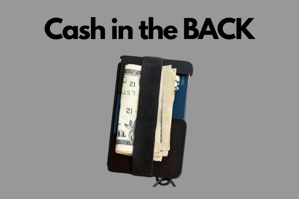Cash held under the elastic band on the back of the Metal Brik wallet